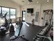 Fitness center featuring cardio machines, free weights, and a weight bench, providing a complete workout area at 1264 Riverscape St # B, Bradenton, FL 34208
