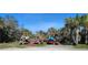Outdoor storage of kayaks and canoes with lush green trees in the background on a sunny day at 1264 Riverscape St # B, Bradenton, FL 34208