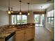 Kitchen with stainless steel appliances, granite countertops, overlooking picturesque outdoor view at 1264 Riverscape St # B, Bradenton, FL 34208