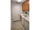 Convenient laundry room with front load washer, dryer and extra storage space at 1264 Riverscape St # B, Bradenton, FL 34208