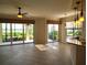 Bright and airy living room has tiled floors, ceiling fan, and access to water view patio at 1264 Riverscape St # B, Bradenton, FL 34208