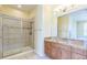 Bathroom featuring a walk-in shower and vanity with granite top at 1330 16Th St, Sarasota, FL 34236