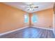 Bedroom with laminate flooring, overhead fan, and dual windows at 1330 16Th St, Sarasota, FL 34236
