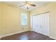 Comfortable bedroom features a ceiling fan, closet, one window, and wood-look flooring at 1330 16Th St, Sarasota, FL 34236