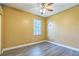 Bedroom with laminate flooring, overhead fan, and a window at 1330 16Th St, Sarasota, FL 34236