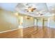 Large main bedroom with ceiling fans, wood floors, and access to the bathroom and closet at 1330 16Th St, Sarasota, FL 34236