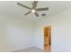 Bright bedroom featuring tile floor, ceiling fan, and ensuite bathroom at 15507 Sunny Day Dr, Bradenton, FL 34211