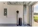 View of garage featuring water purification system, electrical panel, and epoxy floors at 15507 Sunny Day Dr, Bradenton, FL 34211
