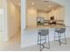 Modern kitchen with bar seating, granite countertops and stainless steel appliances at 15507 Sunny Day Dr, Bradenton, FL 34211