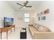 Cozy living room featuring decorative wall art, sofa, and a flat screen television at 15507 Sunny Day Dr, Bradenton, FL 34211