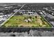 An aerial view showcasing the property lines of a large lot featuring lush greenery and mature trees around the perimeter at 16305 E State Road 64, Bradenton, FL 34212
