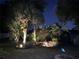 Landscaped backyard with decorative lighting and tropical foliage creates a serene, private outdoor space at 1631 Madison Ave, North Port, FL 34286