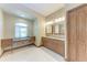 Bathroom featuring a desk with drawers by the window and a double vanity at 1631 Madison Ave, North Port, FL 34286