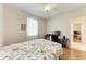 Bedroom with wood floors, ceiling fan, and a desk with a computer at 1631 Madison Ave, North Port, FL 34286