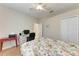 Bedroom with laminate floors, ceiling fan, closet and work space at 1631 Madison Ave, North Port, FL 34286