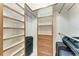 Closet with built in drawers, shelving and hanging racks for ample storage at 1631 Madison Ave, North Port, FL 34286