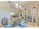 Cozy dining area showcases a glass table, stylish chairs, and display cabinet, with an open layout at 1631 Madison Ave, North Port, FL 34286