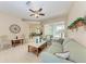 Inviting living room with a comfortable sofa, ceiling fan, and a view of the open-concept layout at 1631 Madison Ave, North Port, FL 34286