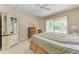 Main bedroom with large bed, dresser, and sliding glass door to the lanai overlooking the pool at 1631 Madison Ave, North Port, FL 34286