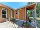 Closed outdoor storage shed with a ramp and nearby tropical landscaping at 1631 Madison Ave, North Port, FL 34286