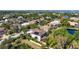 Aerial view of a charming home, nestled in a lush neighborhood with a pond at 1719 Kenilworth St, Sarasota, FL 34231