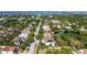 Aerial view of the home in a tranquil, green neighborhood with water views at 1719 Kenilworth St, Sarasota, FL 34231