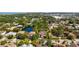 Aerial view of the neighborhood featuring mature trees, a pond, and a well-maintained community at 1719 Kenilworth St, Sarasota, FL 34231