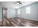 Bedroom featuring wood-look flooring, natural light, and a neutral color scheme; a serene retreat at 1719 Kenilworth St, Sarasota, FL 34231