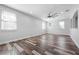 Light-filled bedroom with wood-look flooring, recessed lighting, and multiple windows at 1719 Kenilworth St, Sarasota, FL 34231