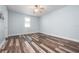 Bedroom with wood-look flooring, a ceiling fan, and one window allowing natural light at 1719 Kenilworth St, Sarasota, FL 34231