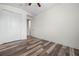 Bedroom with wood-look flooring, double closets, and a neutral color scheme; perfect for personalization at 1719 Kenilworth St, Sarasota, FL 34231