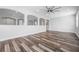 Spacious bonus room with decorative wall cut-outs, recessed lights, and wood-look flooring at 1719 Kenilworth St, Sarasota, FL 34231