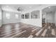 Large bonus room boasting decorative wall cut-outs, recessed lighting, and stylish wood-look floors at 1719 Kenilworth St, Sarasota, FL 34231