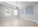Bright dining area features neutral paint, decorative lighting, and large windows at 1719 Kenilworth St, Sarasota, FL 34231