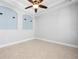 Empty room with neutral colors, crown molding, recessed lighting, and tiled floors at 1719 Kenilworth St, Sarasota, FL 34231