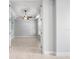 Bright, empty room with neutral colors, crown molding, natural lighting, and tiled floors at 1719 Kenilworth St, Sarasota, FL 34231