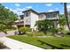 Beautiful two-story home with a red tile roof, well-manicured lawn, and lush landscaping at 1719 Kenilworth St, Sarasota, FL 34231