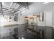 Spacious three-car garage featuring epoxy floors, shelving, and ample storage space at 1719 Kenilworth St, Sarasota, FL 34231