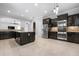 Open kitchen with island features granite countertops, stainless steel appliances, and mosaic backsplash at 1719 Kenilworth St, Sarasota, FL 34231