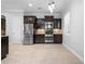 Open kitchen features granite countertops, stainless steel appliances, and mosaic backsplash at 1719 Kenilworth St, Sarasota, FL 34231