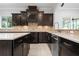 Open kitchen features granite countertops, stainless steel appliances, and mosaic backsplash at 1719 Kenilworth St, Sarasota, FL 34231