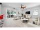 Bright living room features stylish furnishings, tile flooring, and sliding glass doors to the outdoor patio at 1719 Kenilworth St, Sarasota, FL 34231