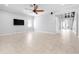 Bright, open living room with tile flooring, neutral walls, and modern ceiling fan at 1719 Kenilworth St, Sarasota, FL 34231