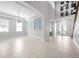 Bright living room featuring neutral colors, recessed lighting, a double-door entry, and tiled floors at 1719 Kenilworth St, Sarasota, FL 34231