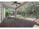 Screened patio with brick pavers, ceiling fan, and view of pool and backyard at 1719 Kenilworth St, Sarasota, FL 34231