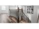 View of a staircase with wood flooring and a decorative railing leading to the upper level at 1719 Kenilworth St, Sarasota, FL 34231