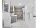 Clean and modern bathroom with tile floors and a walk-in shower at 221 Duxbury Ave, Port Charlotte, FL 33952