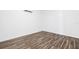 Bedroom featuring wood-look floors and mini-split air conditioning unit at 221 Duxbury Ave, Port Charlotte, FL 33952