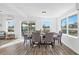 Bright dining room features hardwood floors, modern decor, and lots of natural light at 221 Duxbury Ave, Port Charlotte, FL 33952