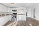 Modern kitchen featuring sleek white cabinets, stainless steel appliances, and beautiful granite countertops, ready for cooking at 221 Duxbury Ave, Port Charlotte, FL 33952